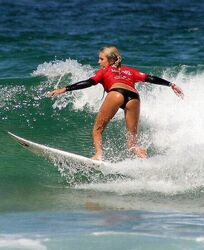 Get wet n wild with sexy surfer chicks. Photo #2